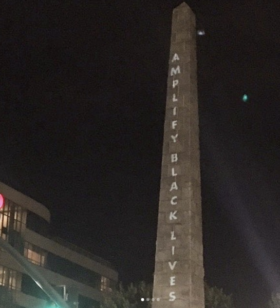 Vance Monument in Downtown Asheville, with projected words onto the structure: "Amplify Black Lives"